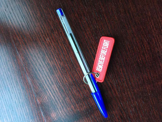 Llavero tejido REMOVE pequeño. 5,5 cm.